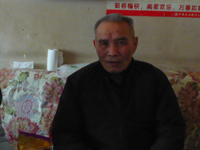 邹良九